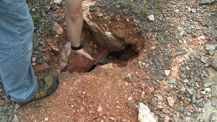 Bobby Hughes found a small sinkhole during the cleanup effort. Hot gases from the underground mine fire were coming out of the hole.