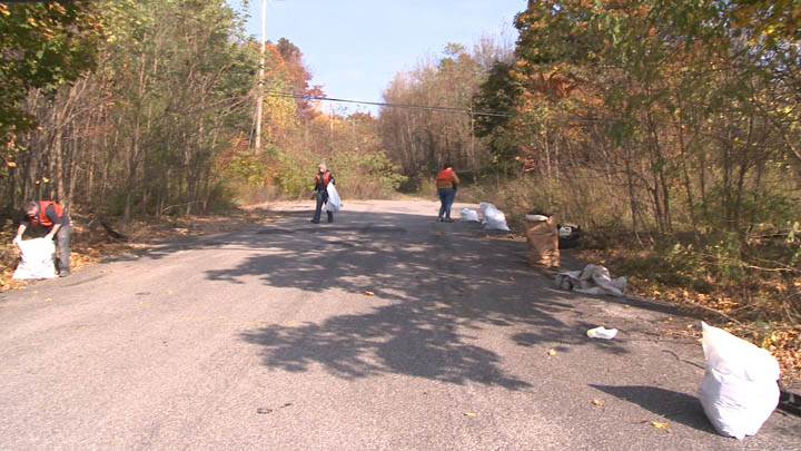 Volunteers cleanup trash along Trautwine Street in Centralia Pennsylvania.