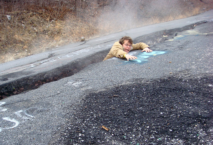 Falling into a fissure on old Route 61 in Centralia. Credit: Flickr/nicksherman